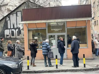 a group of people standing outside of a store at Apartman Valdano in Belgrade