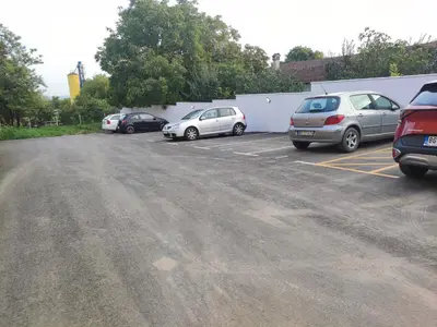 a group of cars parked in a parking lot at BellaCasa AirportStudio in Surčin