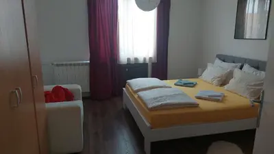 a bedroom with a bed with two towels on it at Charming and stylish centrally located 50m2 in Belgrade