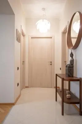 a hallway with a door and a mirror at Dani City Center Apartment in Belgrade