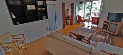 a living room with a couch and a table at Sokolov Apartment in Smederevo