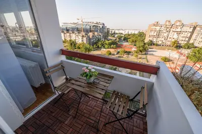 a balcony with a bench and a view of a city at Marshal Nbg in Belgrade
