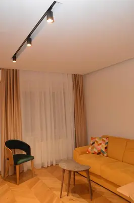 a living room with a couch and a chair at Unca in Belgrade