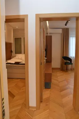 a view of a room with a bed and a mirror at Unca in Belgrade