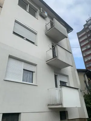 a white building with balconies on the side of it at Lana in Arandjelovac