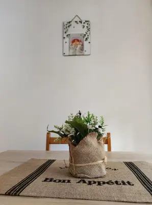 a plant in a burlap bag sitting on a table at Banjica 2 in Voždovac