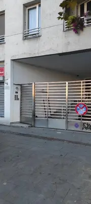 a building with two garage doors on the side of it at Luka 1718 Apartments in Belgrade