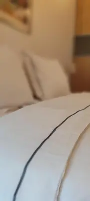 a close up of the corner of a bed at Luka 1718 Apartments in Belgrade
