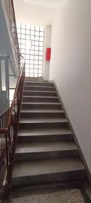 a staircase in a building with a stair case at Indigo Apartment in Belgrade