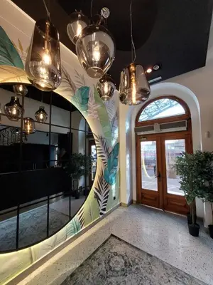 a hallway with a large mirror and a door at Pedestrian street Center of Belgrade - mini rooms with paid PARKING in Belgrade