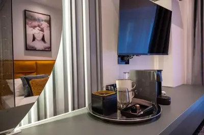 a kitchen counter with a blender on a table at Pedestrian street Center of Belgrade - mini rooms with paid PARKING in Belgrade