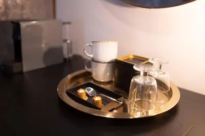 a tray with candles and other items on a table at Pedestrian street Center of Belgrade - mini rooms with paid PARKING in Belgrade