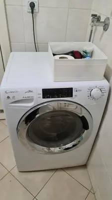 a washing machine with a box on top of it at Belville Delta City apartment, free parking in Belgrade