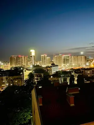 a view of a city skyline at night at Vip Lounge 63 in Belgrade