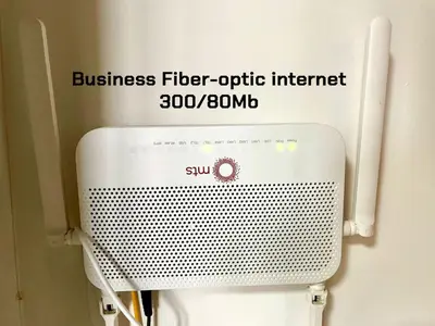 a sign for a business fiber optic internet above a toilet at Vip Lounge 63 in Belgrade