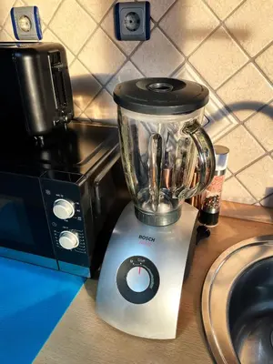 a blender sitting on a counter next to a microwave at Vip Lounge 63 in Belgrade