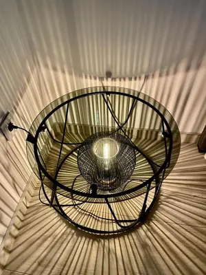 a large metal light hanging from a ceiling at Vip Lounge 63 in Belgrade