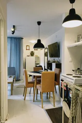 a kitchen and dining room with a table and chairs at Apartment Smokva in Belgrade