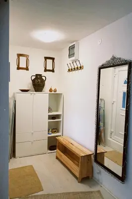 a dressing room with a mirror and a dresser at Apartment Smokva in Belgrade