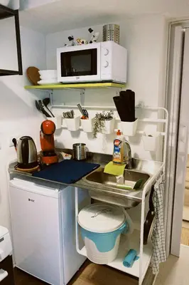 a small kitchen with a sink and a microwave at Apartment Smokva in Belgrade