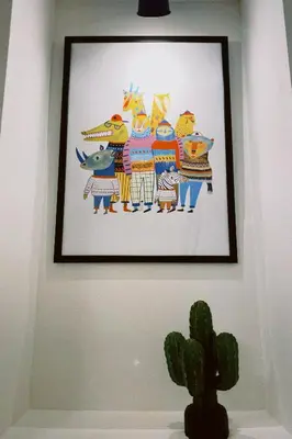 a framed picture of a group of animals on a wall at Apartment Smokva in Belgrade