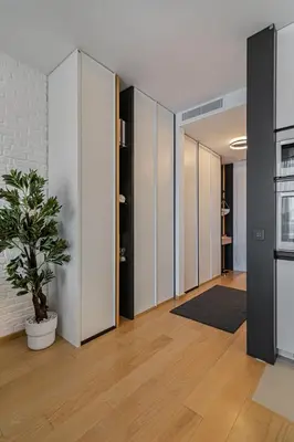 a hallway with rows of lockers and a potted plant at Deer Lux apartment Novi Dorcol-free parking in Belgrade