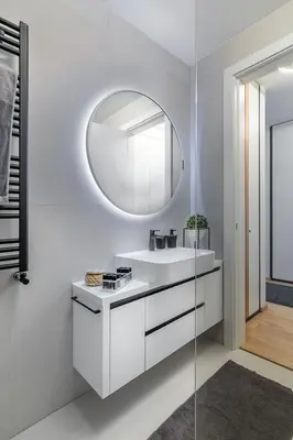 a bathroom with a white sink and a mirror at Deer Lux apartment Novi Dorcol-free parking in Belgrade