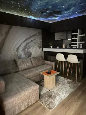 a living room with a couch and a table at Starry Sky in Belgrade