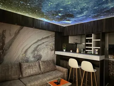 a living room with a couch and a star ceiling at Starry Sky in Belgrade