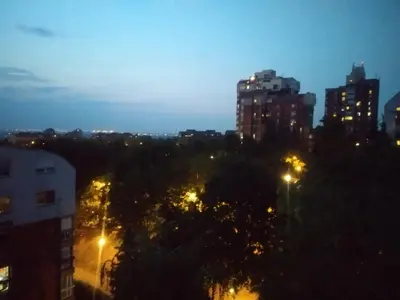 a view of a city at night with lights at Starry Sky in Belgrade