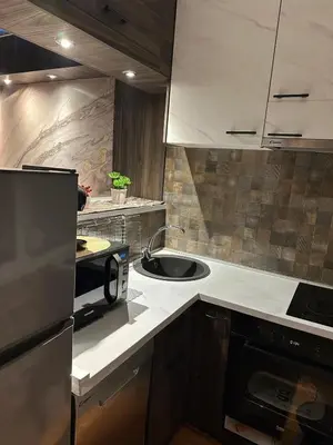 a kitchen with a sink and a counter top at Starry Sky in Belgrade