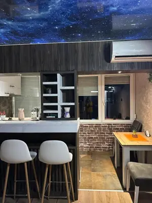 a kitchen with a starry sky mural on the ceiling at Starry Sky in Belgrade