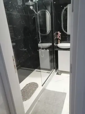 a bathroom with a shower and a sink at Anejo Belvil in Novi Beograd