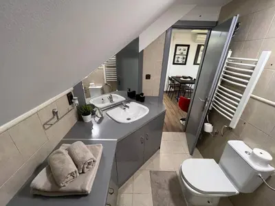 a bathroom with a sink and a toilet at MAIN SQUARE Apartment in Belgrade