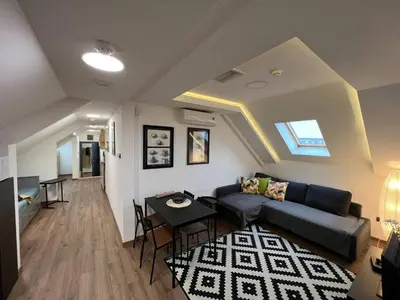 a living room with a couch and a table at MAIN SQUARE Apartment in Belgrade