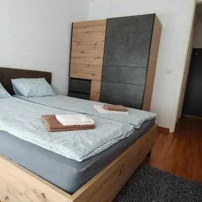 a bedroom with a bed with two towels on it at Apartment Belville, Suncokret 34 in Novi Beograd