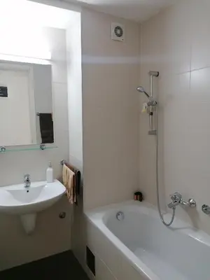 a bathroom with a sink and a tub and a shower at Apartment Belville, Suncokret 34 in Novi Beograd