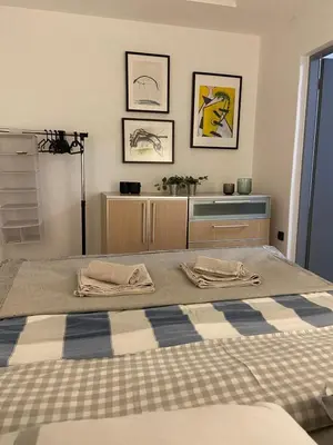 a bedroom with a bed with two towels on it at CITY CENTER Apartment in Belgrade