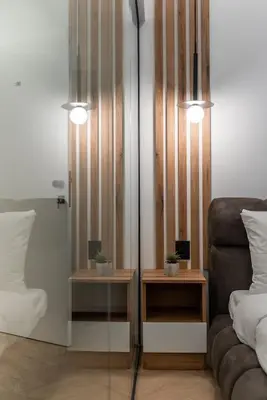 a room with a bed and a couch and two tables at Silver Luxury Suites in Belgrade