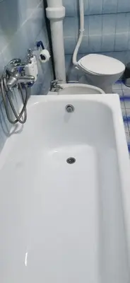 a white bath tub in a bathroom with a toilet at Belgrade centrum in Karaburma