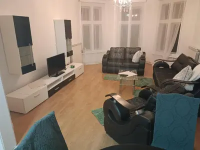 a living room with couches and a flat screen tv at Belgrade centrum in Karaburma