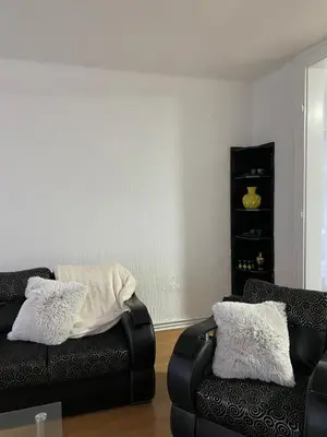 a living room with two chairs and a couch at Belgrade centrum in Karaburma