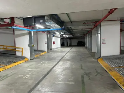 an empty hallway of a building with a parking garage at Bulevard Luxury Suites in Belgrade