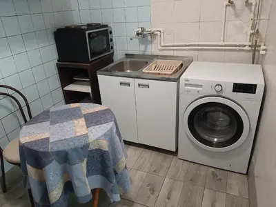 a kitchen with a washing machine and a sink at Belgrade city residence, silent and comfortable in Belgrade