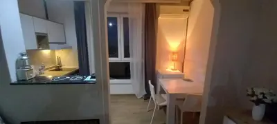 a kitchen with two sinks and a table in a room at Venac in Belgrade