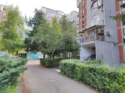 an empty street in front of a building at Venac in Belgrade
