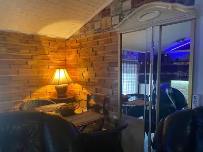 a room with a table and a lamp on a table at Apartment Antik Belgrade in Belgrade