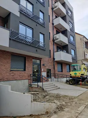 an apartment building under construction with a yellow truck at Apartment Relax 1 in Belgrade