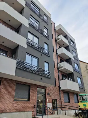 an apartment building with balconies on the side of it at Apartment Relax 1 in Belgrade