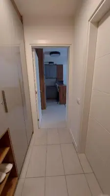 a hallway leading to a room with a bathroom at Apartment Relax 1 in Belgrade
